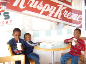 My boys eating donuts in Krispy Kreme